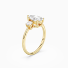 Pear Classic Round Three Stone Large Sides in 18K Yellow Gold angled