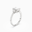 Emerald Classic Round Three Stone Pavé in 18K White Gold angled
