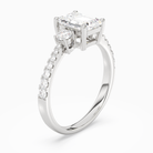 Emerald Classic Round Three Stone Pavé in 18K White Gold angled