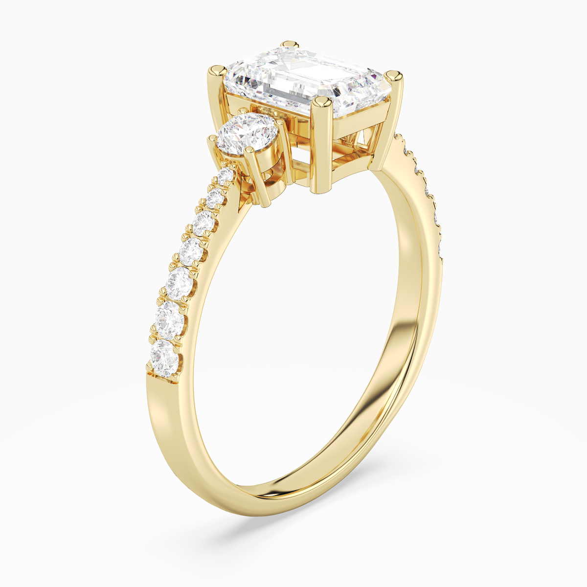 Emerald Classic Round Three Stone Pavé in 18K Yellow Gold angled