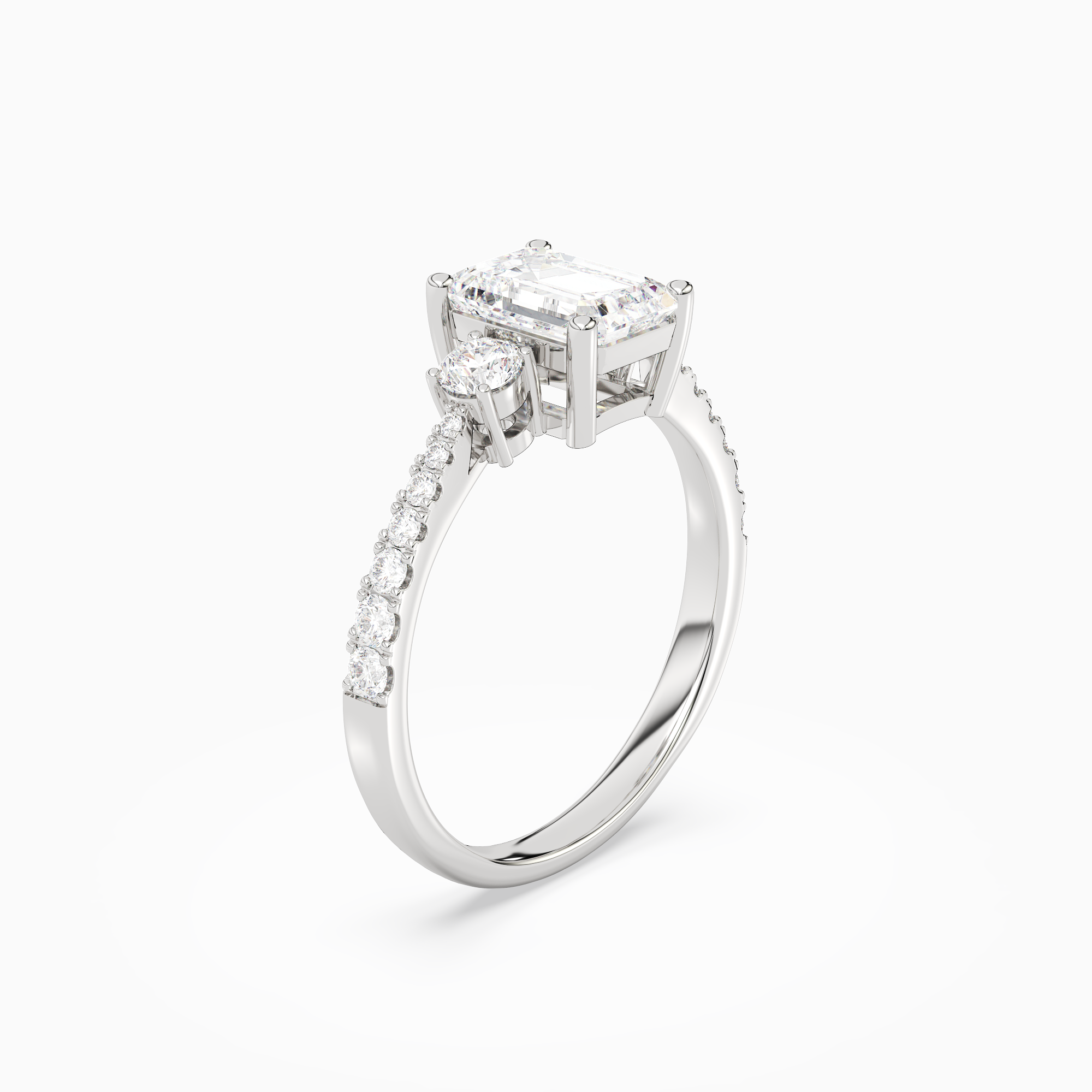 Emerald Classic Round Three Stone Pavé in Platinum angled