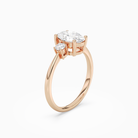 Oval Classic Round Three Stone Small Sides in 14K Rose Gold angled