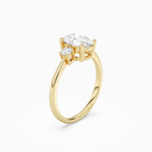 Oval Classic Round Three Stone Small Sides in 18K Yellow Gold angled