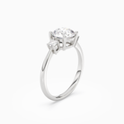Round Classic Round Three Stone Small Sides in 18K White Gold angled