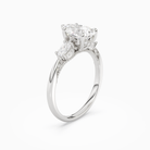 Pear Ornate Accented Three Stone in Platinum angled