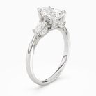 Pear Ornate Accented Three Stone in Platinum angled