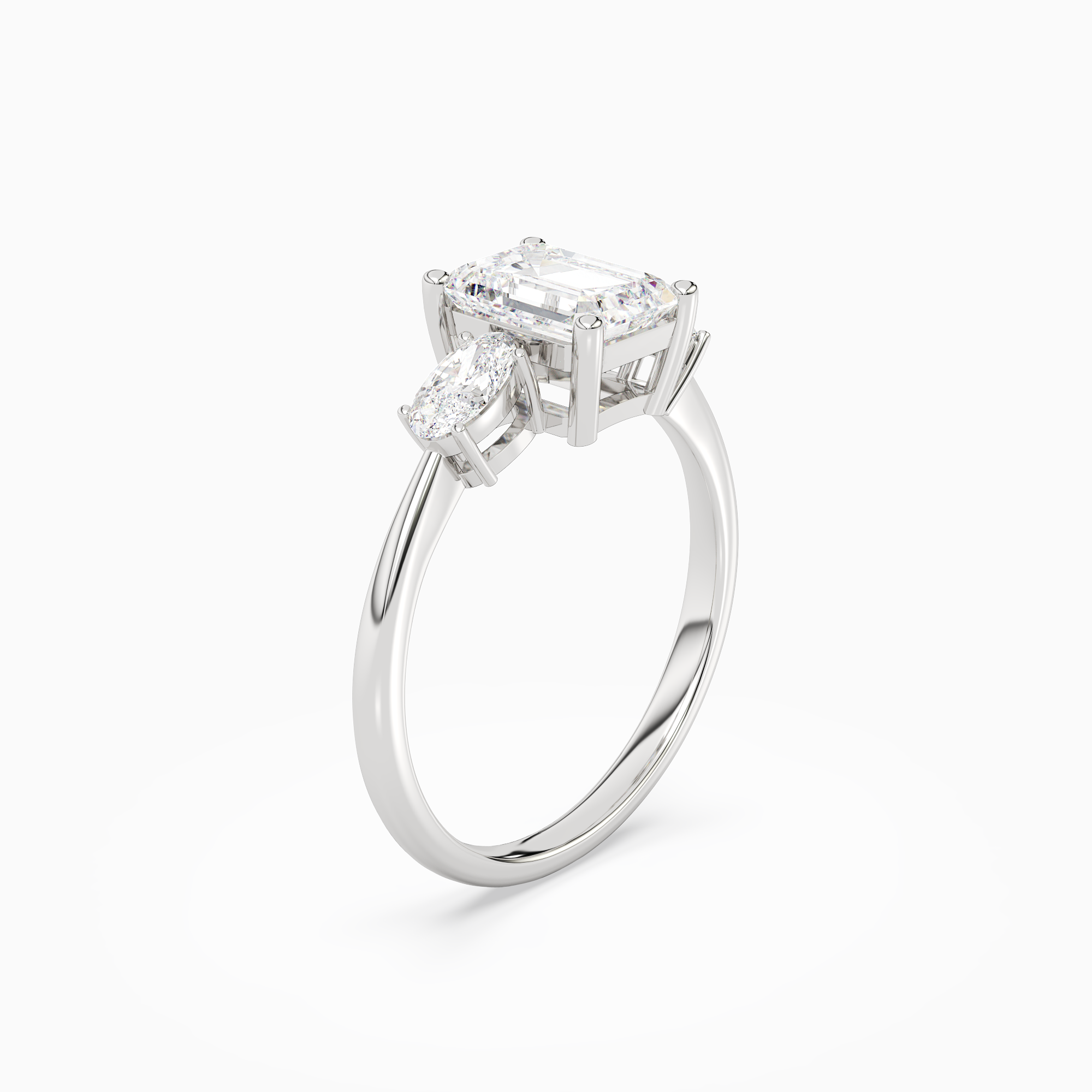 Emerald Classic Three Stone in 18K White Gold angled