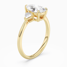 Pear Trillion Three Stone Large Sides in 14K Yellow Gold angled