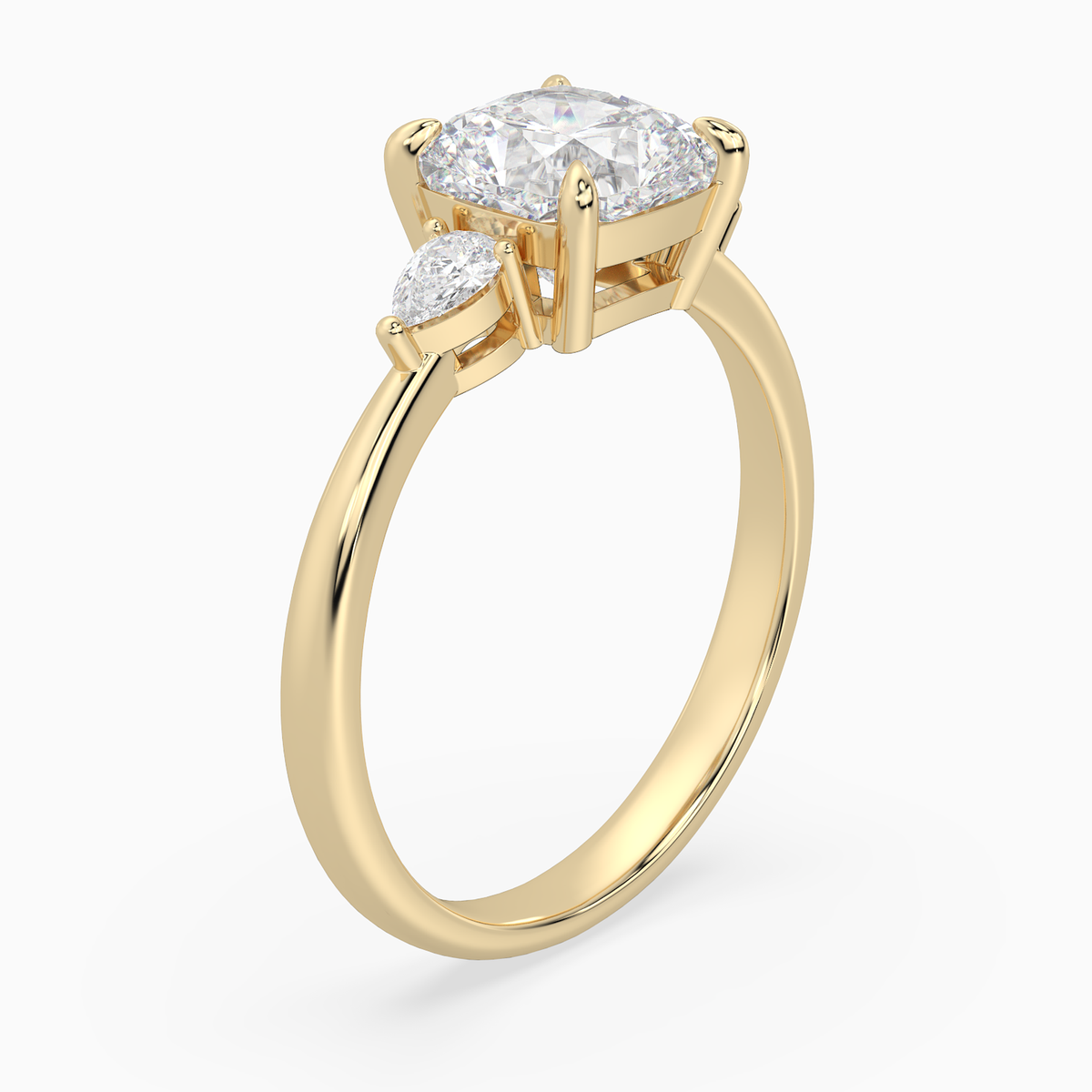 Cushion Pear Side Three Stone Classic in 14K Yellow Gold angled