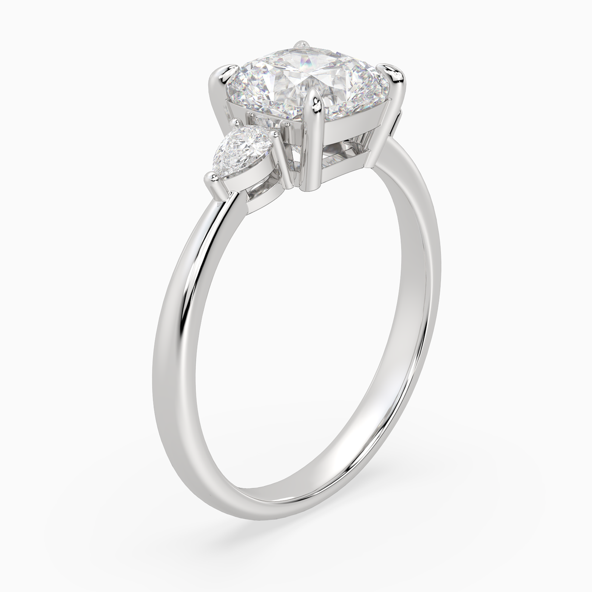 Cushion Pear Side Three Stone Classic in Platinum angled