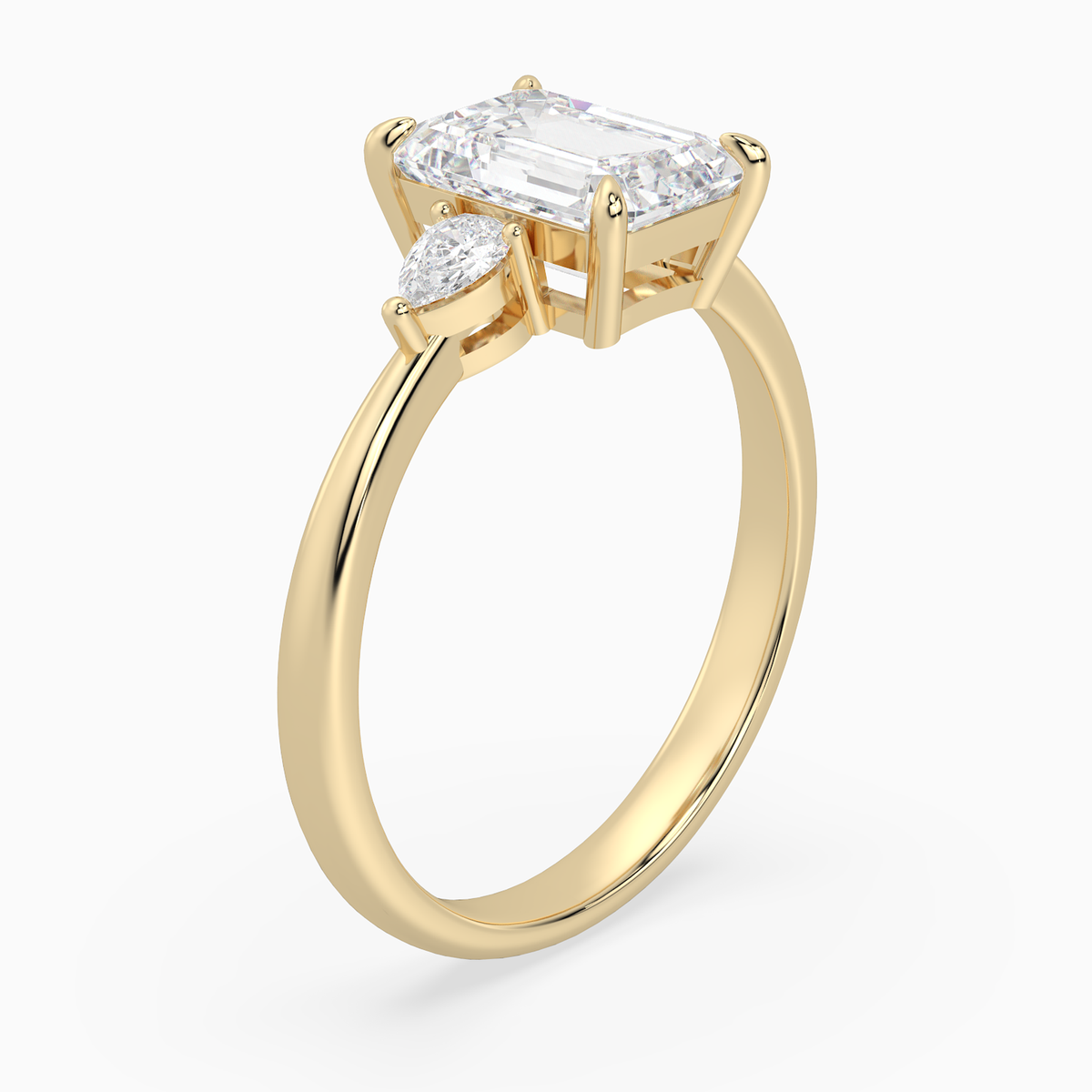 Emerald Pear Side Three Stone Classic in 14K Yellow Gold angled