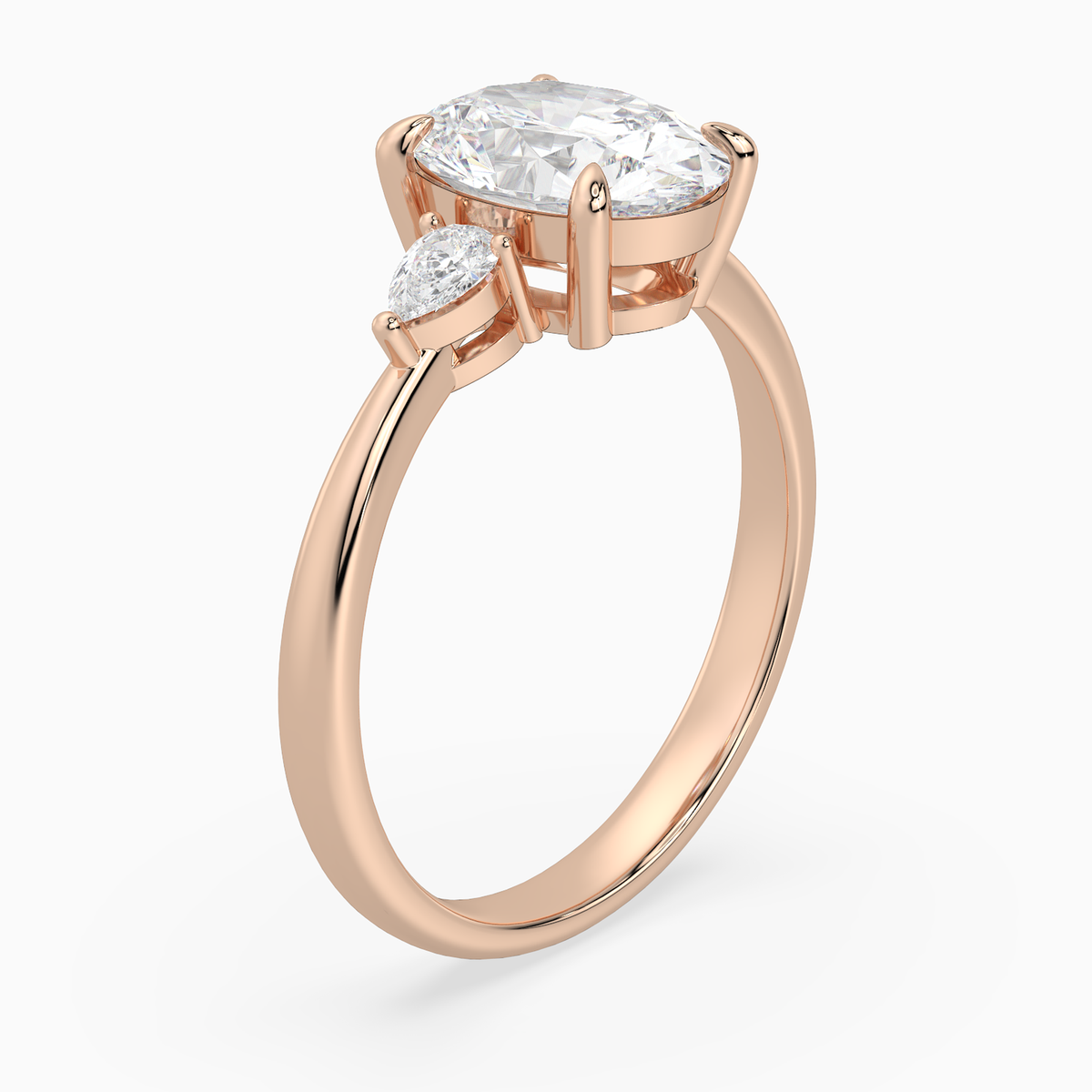 Oval Pear Side Three Stone Classic in 14K Rose Gold angled