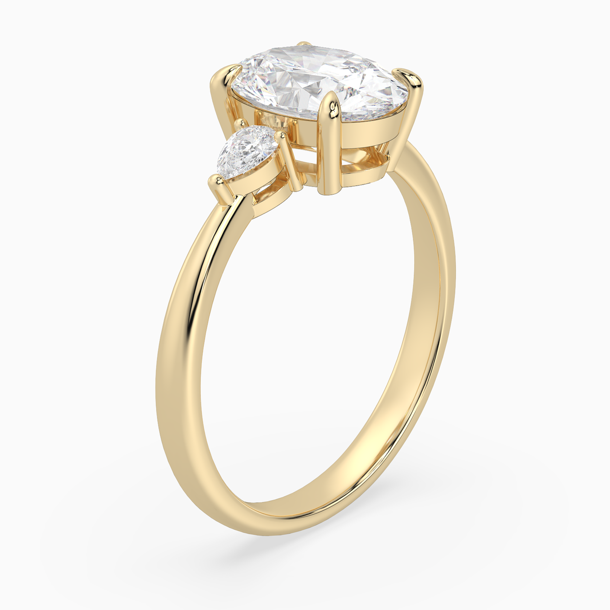 Oval Pear Side Three Stone Classic in 14K Yellow Gold angled