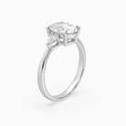 Oval Pear Side Three Stone Classic in Platinum angled