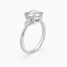 Round Pear Side Three Stone Classic in Platinum angled