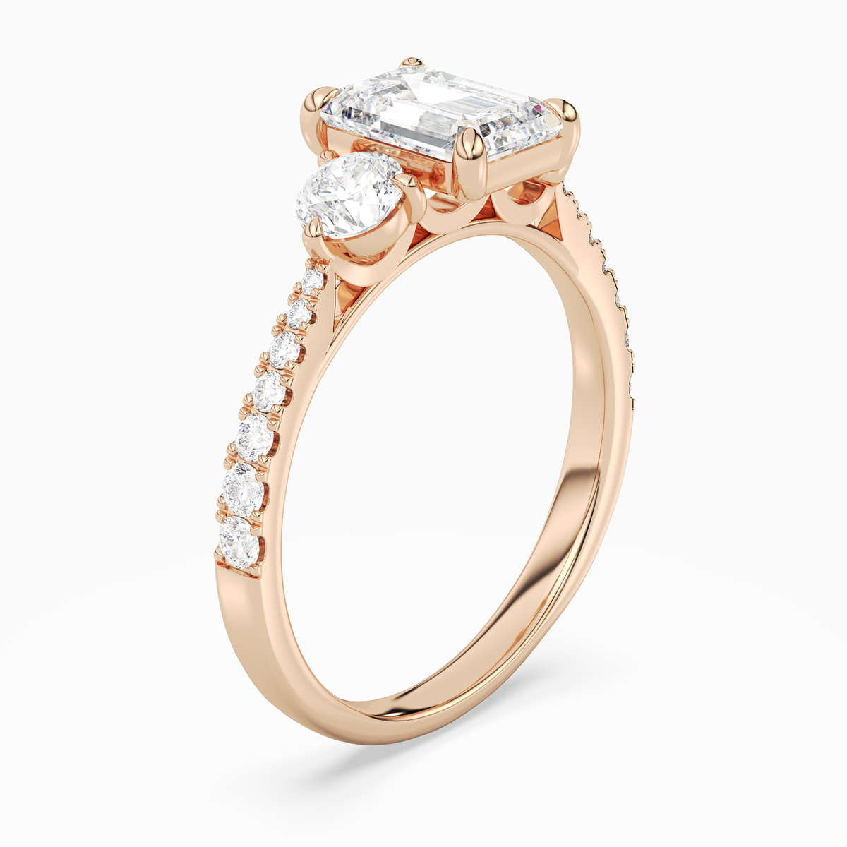 Emerald Round Side Three Stone Pavé in 14K Rose Gold angled