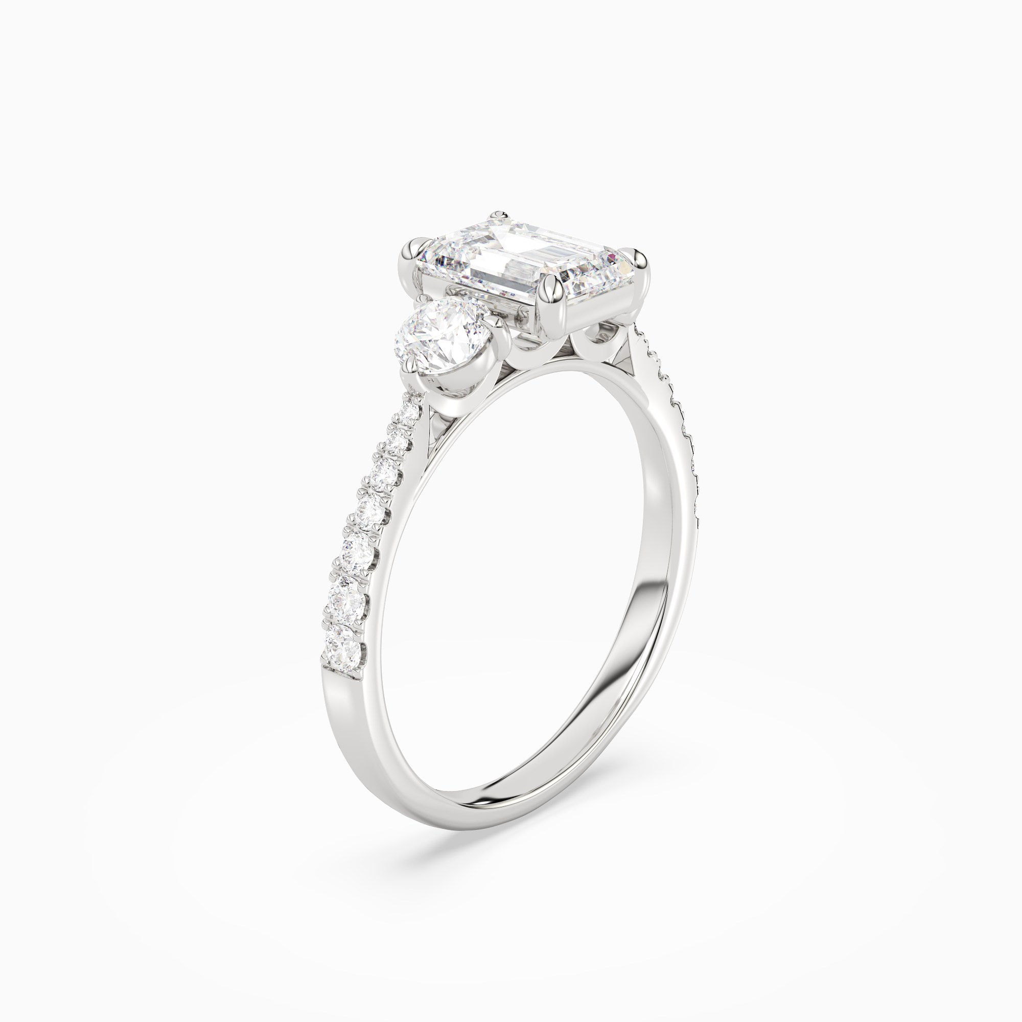 Emerald Round Side Three Stone Pavé in 18K White Gold angled