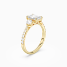 Emerald Round Side Three Stone Pavé in 18K Yellow Gold angled