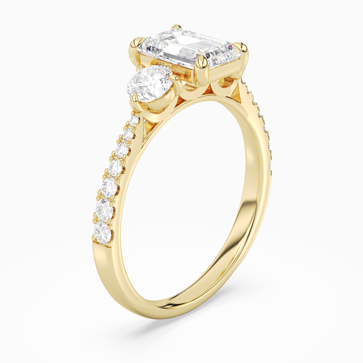 Emerald Round Side Three Stone Pavé in 18K Yellow Gold angled