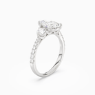 Pear Round Side Three Stone Pavé in 18K White Gold angled