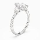 Pear Round Side Three Stone Pavé in Platinum angled