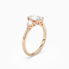Oval Round Side Three Stone Plain in 14K Rose Gold angled