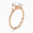 Oval Round Side Three Stone Plain in 14K Rose Gold angled