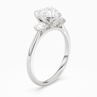 Heart Pear Three-Stone with Round Sides in Platinum angled