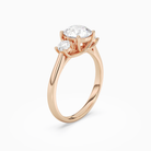 Round Round Three-Stone with Pear Sides in 14K Rose Gold angled