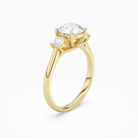 Round Round Three-Stone with Pear Sides in 14K Yellow Gold angled