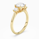 Round Round Three-Stone with Pear Sides in 18K Yellow Gold angled