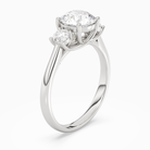 Round Round Three-Stone with Pear Sides in Platinum angled