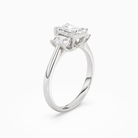 Emerald Emerald Three-Stone with Step-Cut Sides in Platinum angled