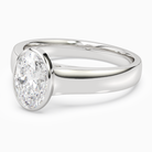 Oval Wide Tapered Bezel Solitaire in 18K White Gold top angle