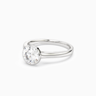 Round Medium Tapered Bezel Solitaire in 18K White Gold top angle