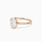 Oval Slim Tapered Bezel Solitaire in 14K Rose Gold top angle