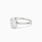 Oval Slim Tapered Bezel Solitaire in 14K White Gold top angle