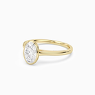 Oval Slim Tapered Bezel Solitaire in 14K Yellow Gold top angle