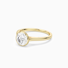Round Slim Tapered Bezel Solitaire in 18K Yellow Gold top angle