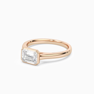 Emerald East-West Bezel Solitaire in 14K Rose Gold top angle