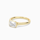 Emerald East-West Bezel Solitaire in 14K Yellow Gold top angle
