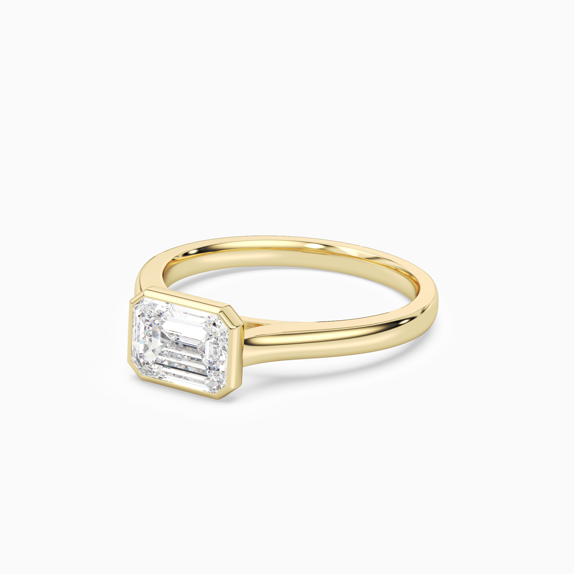 Emerald East-West Bezel Solitaire in 14K Yellow Gold top angle