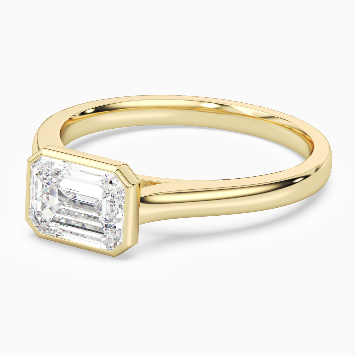Emerald East-West Bezel Solitaire in 18K Yellow Gold top angle