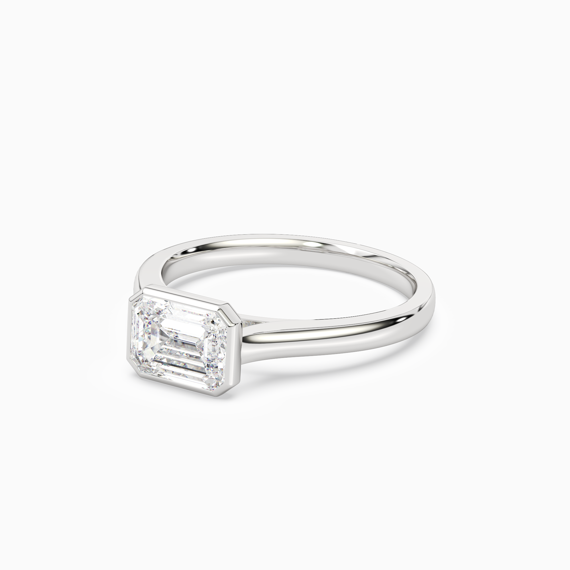 Emerald East-West Bezel Solitaire in Platinum top angle