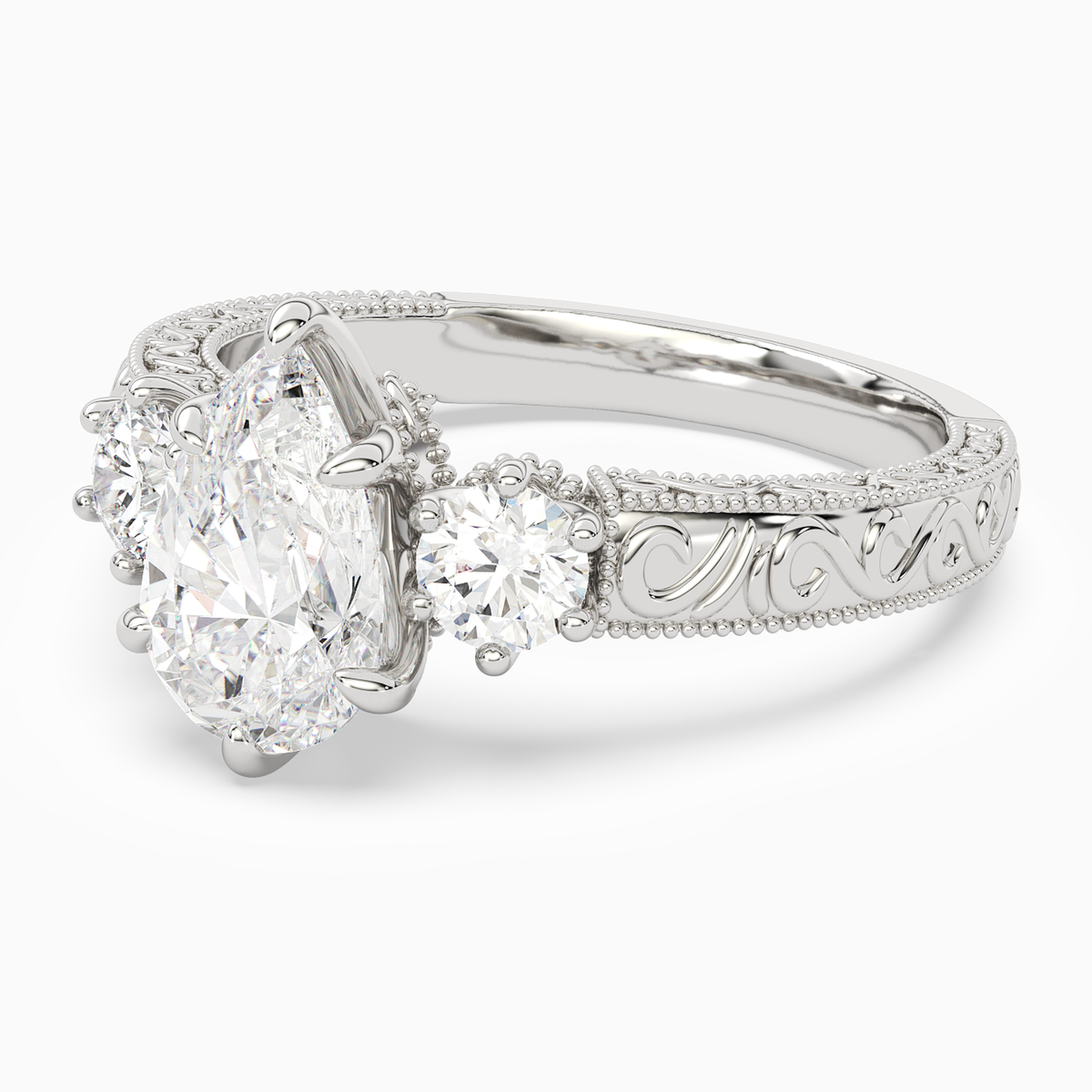 Pear Engraved Vintage Three Stone in Platinum top angle