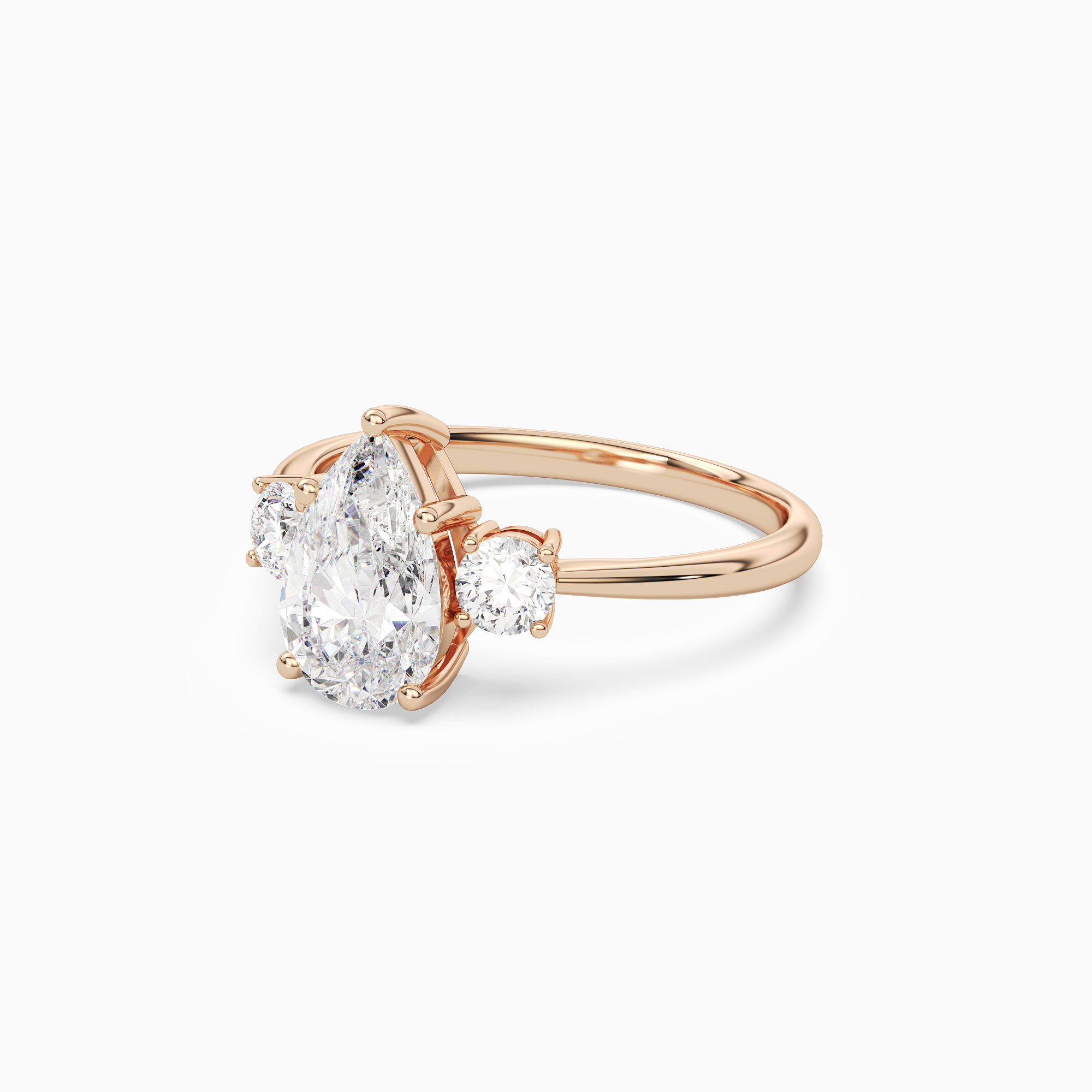 Pear Classic Round Three Stone Large Sides in 14K Rose Gold top angle
