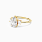 Pear Classic Round Three Stone Large Sides in 14K Yellow Gold top angle