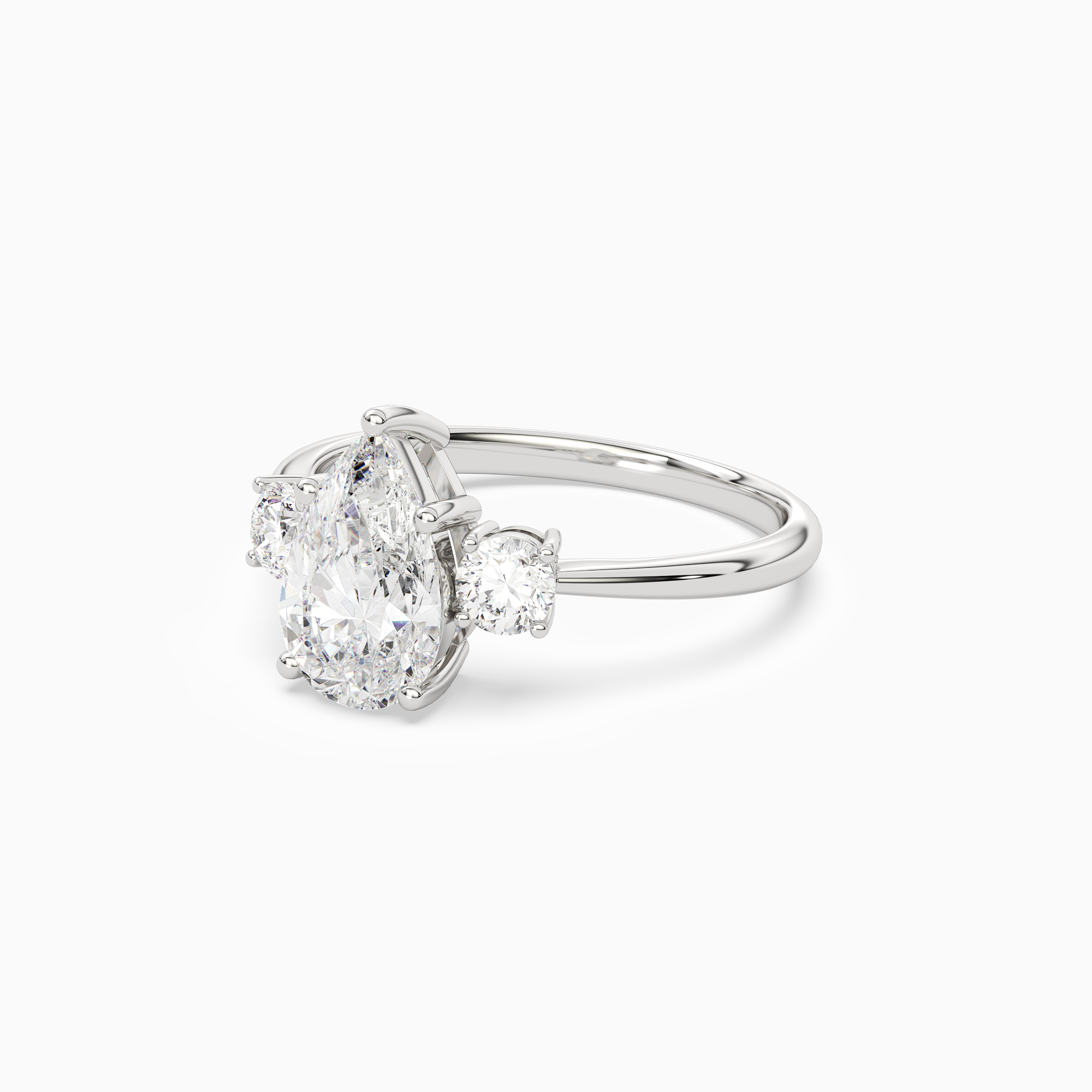 Pear Classic Round Three Stone Large Sides in Platinum top angle