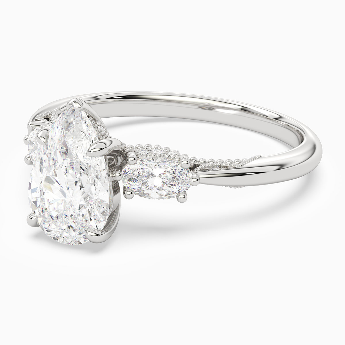 Pear Ornate Accented Three Stone in Platinum top angle