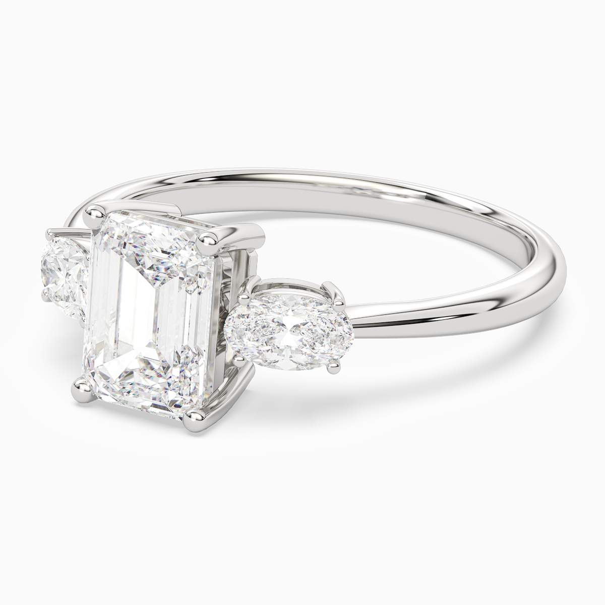 Emerald Classic Three Stone in Platinum top angle